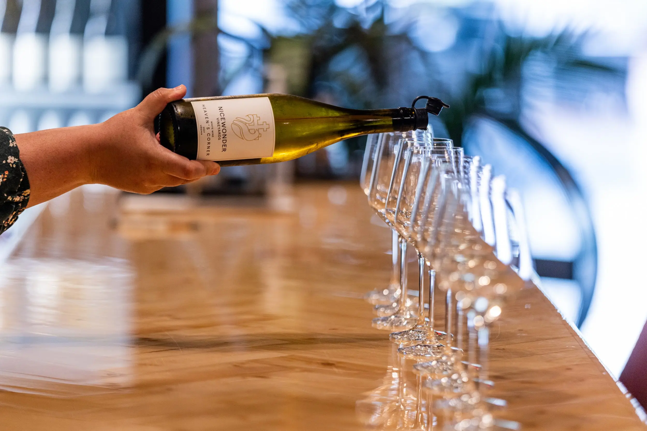pouring wine into glasses