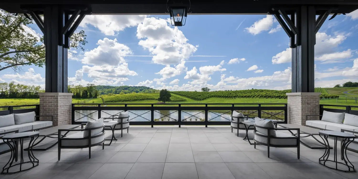 outdoor seating with view of pond and vineyard